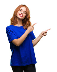 Young beautiful woman over isolated background smiling and looking at the camera pointing with two hands and fingers to the side.