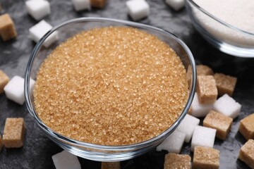Brown sugar in bowl on table, closeup
