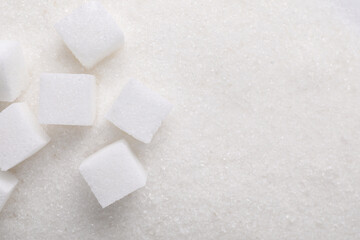 Different types of sugar as background, top view. Space for text