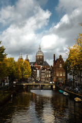 Amsterdam canals with autumn colours and old buildings cloudy day_1