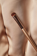 Elegant Makeup Brush on Textured Fabric - 711431858