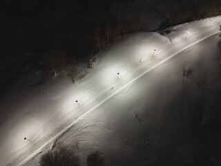 Night photo from a drone in winter. Pedestrian road and street lights.