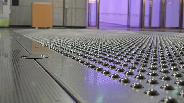 People Walking on Innovative Floor With Bumps Which Removes Fine Dust and Viruses From Shoes Installed at Seoul Forest Subway Station, South Korea - close-up