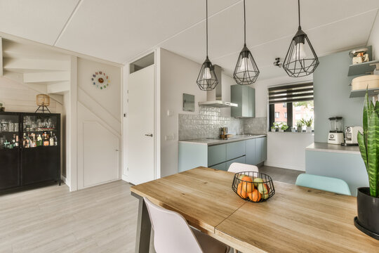 Modern kitchen interior with stylish dining area