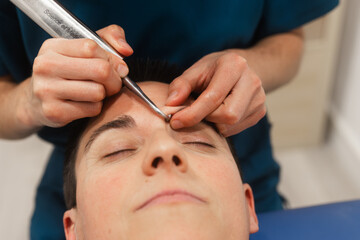 Professional Eyebrow Shaping with Precision Tweezers