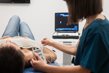 Male patient undergoing echocardiogram in clinic
