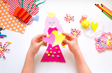 Child creating homemade greeting card with princess. Gift for Mothers day, Birthday or Valentines...