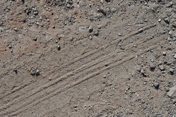 Tire marked on dirt street