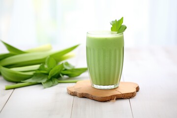 aloe vera smoothie in a glass with leaves garnish