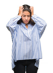 Young beautiful arab woman over isolated background suffering from headache desperate and stressed because pain and migraine. Hands on head.