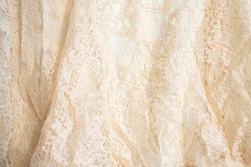 Texture of lace fabric. lace on a white background studio. thin fabric made of yarn or thread....