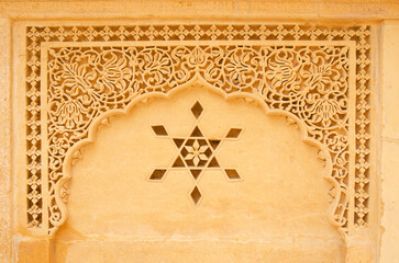 Carving or stone carving on the wall of Amar sagar jain temple, Jaisalmer, Rajasthan, India, Asia. Background. Backdrop. Wallpaper.