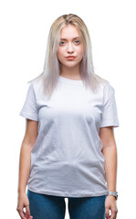 Fototapeta premium Young blonde woman over isolated background with serious expression on face. Simple and natural looking at the camera.