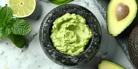 Create a vegan beauty product by blending fresh avocado in a mortar for an at-home spa treatment.