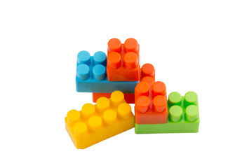 Children toys; colorful plastic blocks on the white background.