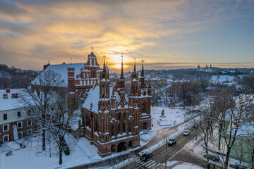 Aerial beautiful winter snowy sunrise view of Vilnius old town, St. Anne's Church (Vilniaus Šv....