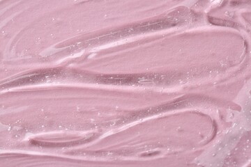 Obraz na płótnie Canvas Clear cosmetic serum on pink background, macro view