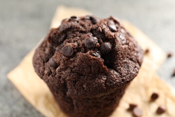 Delicious fresh chocolate muffin on table, closeup