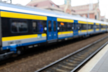Blurry background image of a train and station. Long-distance train. Touristic concepts.