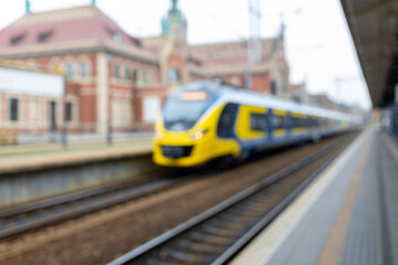 Blurry background image of a train and station. Long-distance train. Touristic concepts.