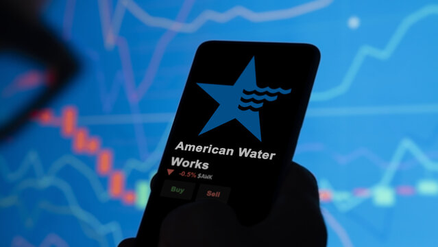 January 15th 2024 Camden, New Jersey. The logo of American Water Works on the screen of an exchange. American Water Works price stocks, $AWK on a device.
