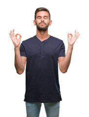 Young handsome man over isolated background relax and smiling with eyes closed doing meditation gesture with fingers. Yoga concept.