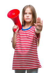 Young beautiful girl yelling through megaphone over isolated background with open hand doing stop...