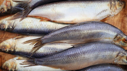 Freshly caught fresh herring sold at the fish market - Background, texture, concept of healthy fish and rich in omega 3