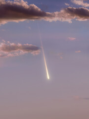 Fototapeta na wymiar Fireball in the sky at sunset. Meteor in the light of the sun. Meteorite in the Earth's atmosphere.