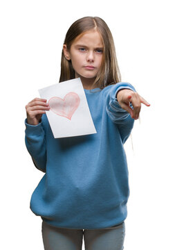 Young beautiful girl giving mother father day card with red heart over isolated background pointing with finger to the camera and to you, hand sign, positive and confident gesture from the front