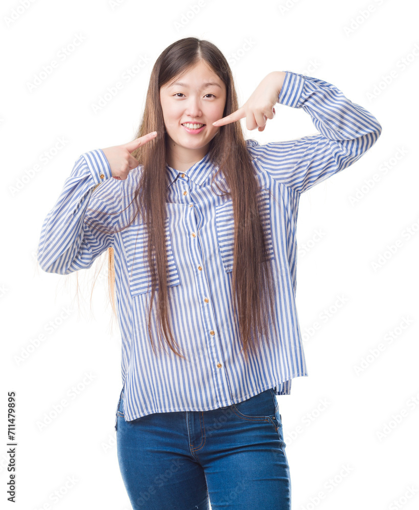 Sticker young chinese woman over isolated background smiling confident showing and pointing with fingers tee