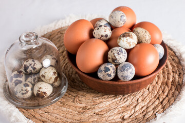 Rustic Easter, quail eggs in a ceramic bowl on the table. The Bright Easter Holiday