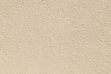 Texture of pastel beige decorative plaster or concrete. Abstract grunge background for design.