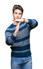 Young handsome man over isolated background Doing time out gesture with hands, frustrated and...