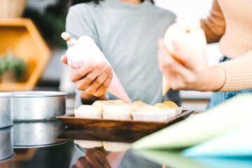 Happy asian family mother and daughter cooking in kitchen preparation for Christmas dinner party