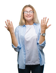 Young caucasian business woman wearing glasses over isolated background celebrating mad and crazy...