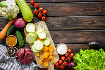 Variety of organic food. Raw beef meat and vegetables for cooking