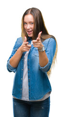 Young caucasian beautiful woman over isolated background pointing fingers to camera with happy and funny face. Good energy and vibes.