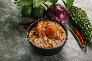 Indian cuisine - chicken curry with spices