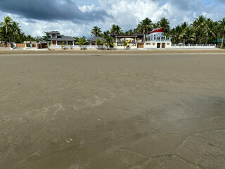 Long span of broad gently sloping strip of fine sand beach lures resort developers to put up...