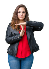 Beautiful plus size young woman wearing a fashion leather jacket over isolated background Doing...