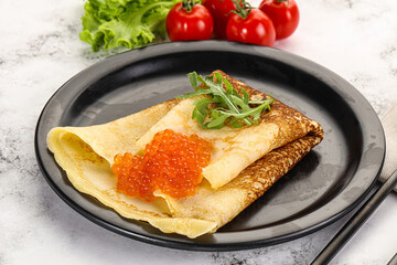 Russian pancake with red caviar