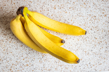 Fresh ripe banana fruit on kitchen tabletop