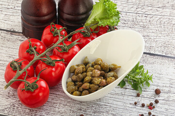 Marinated green capers in the bowl