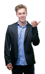 Young handsome blond business man pointing with hand and finger up with happy face smiling