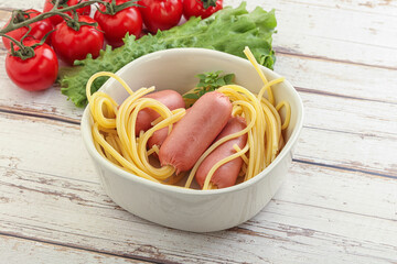 Mini sausages with pasta spaghetti