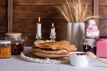 Maslenitsa holiday, pancakes with jam on the table. The Russian tradition
