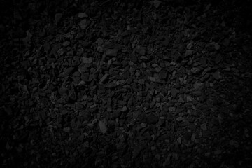 Black stone debris. Rock fragment background.