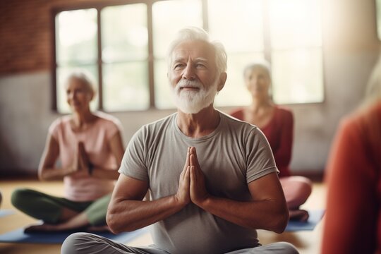 Yoga classes with a group of seniors in gymnasium, learning new poses and practicing mindfulness and positivity