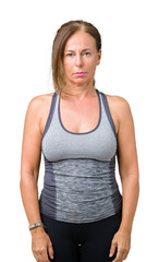 Fototapeta premium Beautiful middle age woman wearing sport clothes over isolated background Relaxed with serious expression on face. Simple and natural looking at the camera.